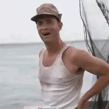 Homer Simpson laughing on a boat