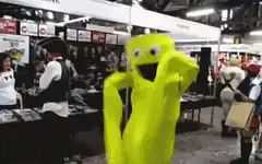 yellow blob mascot dancing at convention