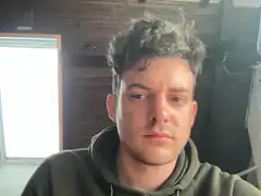 Man with messy hair looking sideways
