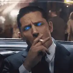 Tom Hardy smoking with glowing blue eyes