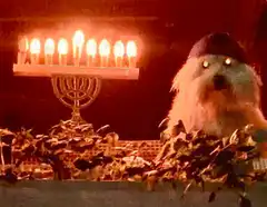 Glowing eyes dog with menorah