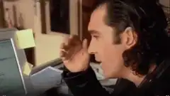 Antonio Banderas frustrated at computer
