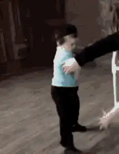 Toddler dodges a hand slap