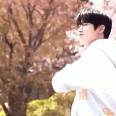man in white hoodie pointing
