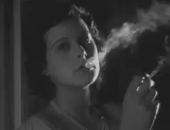 Hedy Lamarr smoking a cigarette