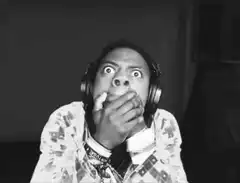 Man with headphones shocked face