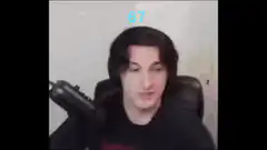 Man with long hair making excited hand gestures