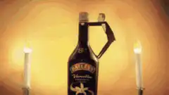 Baileys bottle with dancing paper cutout