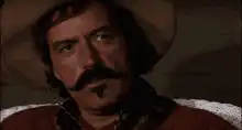 Man in cowboy hat says bye