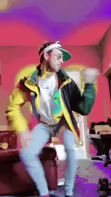 Man in visor dancing in colorful room