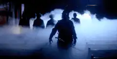 Ninja emerges from smoke with glowing eyes