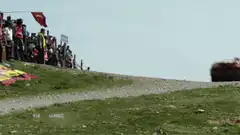 Rally car jumps over spectators