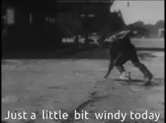 Man struggling in strong wind