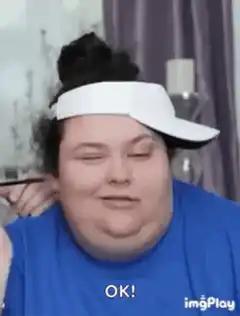 Person in visor saying OK