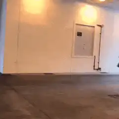 man running through parking garage