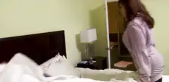 woman falls onto bed