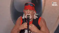 Hulk Hogan rips his shirt open
