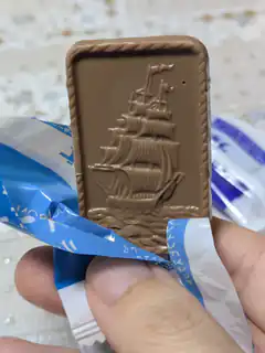 Chocolate bar with ship embossed on it