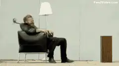 Man swinging sword in chair