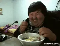 Man eating cereal and laughing