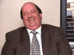 Man in suit laughing