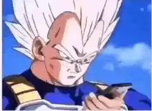 Vegeta looking at phone then smirking
