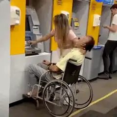Woman grabs cash from ATM while man in wheelchair faints
