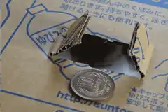 Cotton ball pops out of cardboard