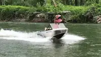 pink bear driving speedboat