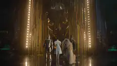Wizard of Oz characters face the giant head