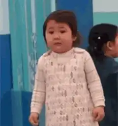 Toddler about to cry then smiles