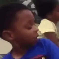 Young boy looking skeptical