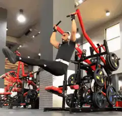 Man doing hanging leg raises in gym
