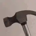 hammer hitting wall