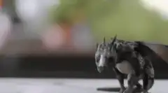 Baby dragon blows smoke ring
