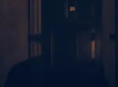 Woman opens door to Charlie Chaplin