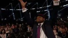 Man dabbing in a crowd
