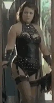 Woman in studded leather outfit