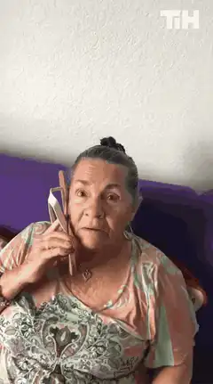 Woman eating with a spoon and fork