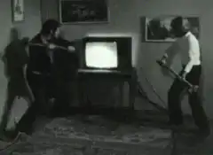 Two men smashing a TV with baseball bats