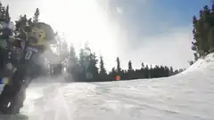 Buffalo mascot snowboarding downhill