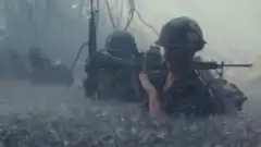 Soldier in mud and rain
