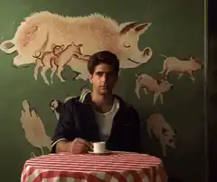 Adrien Brody drinking coffee
