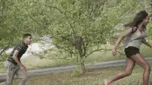 man jumps into woman's arms