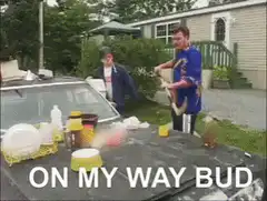 Guy on roof with car full of stuff