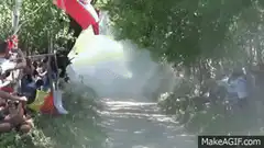 Rally car jumps over spectators
