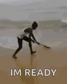 Kid sweeping beach ready
