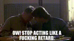 Two men kissing with caption