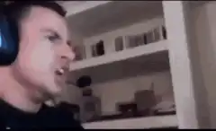 Man screaming into microphone