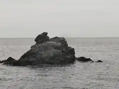 rocky island in calm sea